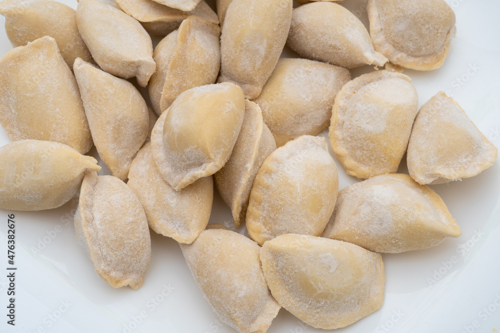 Raw frozen dumplings as background, top view. Raw frozen dumplings as background, top view.