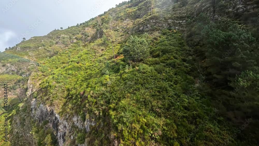 Cliff valley FPV racing drone aerial action camera, scenic landscape with trees and cliffs diving along the rocks. Cliff valley FPV racing drone aerial action camera, scenic landscape with trees and cliffs diving along the rocks.