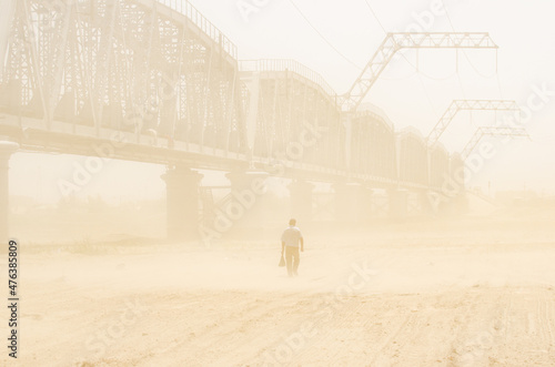Man walking in a sandstorm