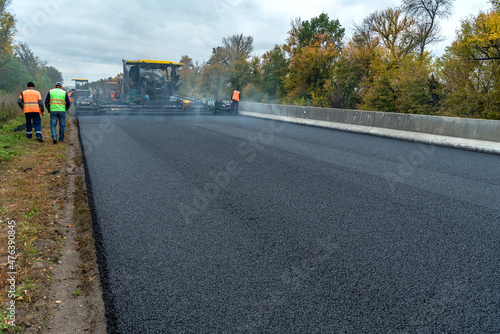 Laying a new asphalt on the road. Construction of the road.