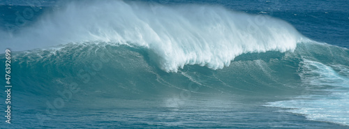 Sport photography. Jaws swell on International surfing event in Maui  Hawai 2021 December.