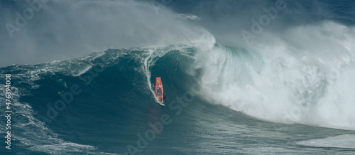 Sport photography. Jaws swell on International surfing event in Maui, Hawai 2021 December. photo
