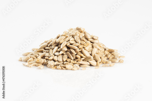 Raw seeds in a glass bowl isolated on white background.