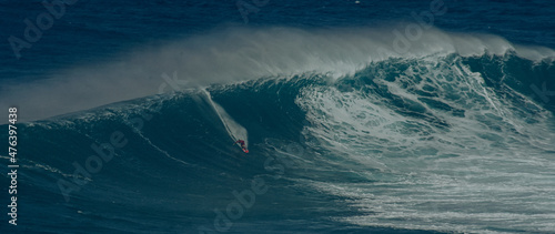 Sport photography. Jaws swell on International surfing event in Maui, Hawai 2021 December.