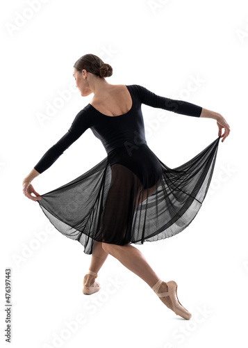 Ballerina in a black dress bowing elegantly to the audience isolated on white background