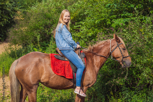 Beautiful woman riding a horse in countryside