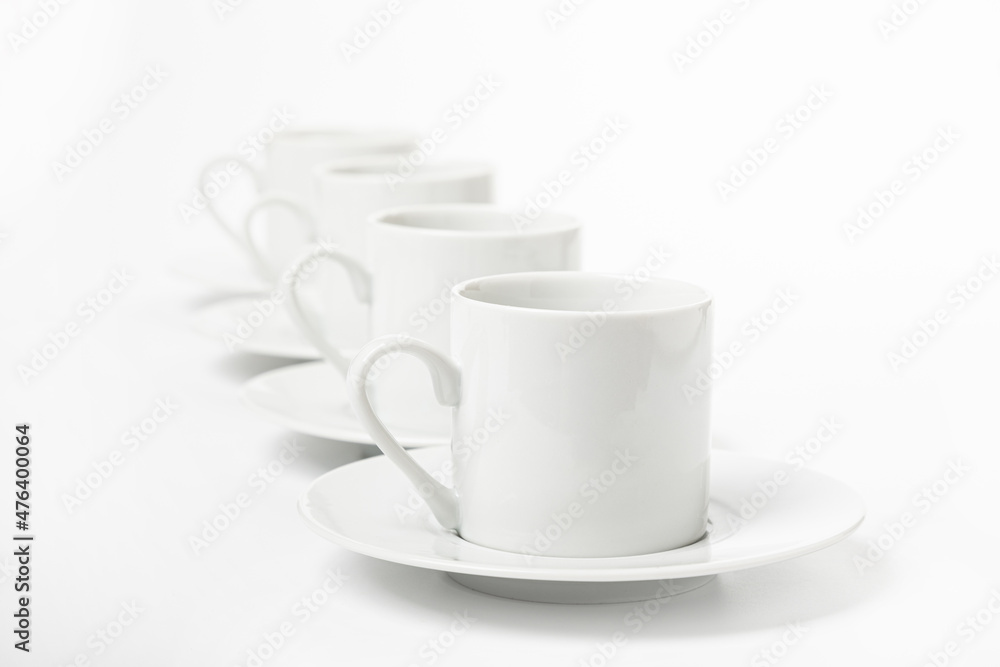 several white porcelain cup and saucer for coffee isolated on white background several white porcelain cup and saucer for coffee isolated on white background