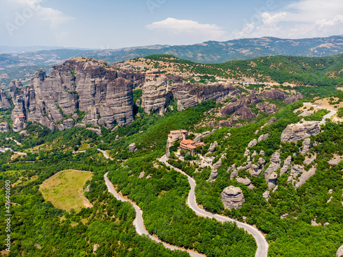 Huge gray rocks Meteors in Greece among green mountain forest