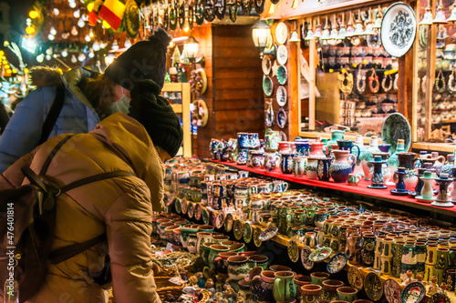 Photography Two Female Tourists Looking And Buying Gifts At The Christmas Market In Bucharest, Romania