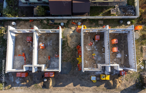 einforced concrete house foundation, poured concrete floor and brick walls. photo