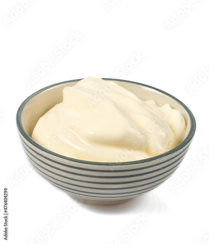 sour cream in a bowl isolated on white background