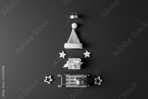 Xmas decorative elements arranged as Christmas tree. Black and white photo