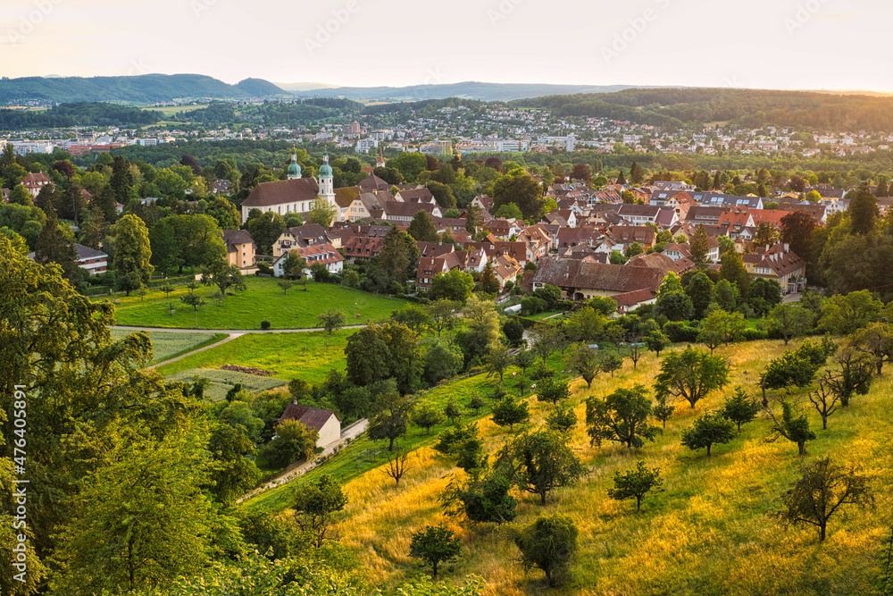 Golden-hour-view to Arlesheim with Arlesheim Cathedral and other parts of Basel-Country, Switzerland.