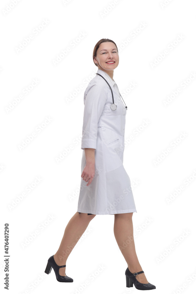 female doctor with a stethoscope striding forward . female doctor with a stethoscope striding forward .