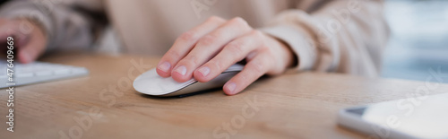 partial view of manager using computer mouse and keyboard in office  banner.