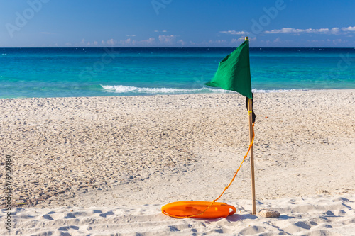 Green flag on the Varadero beach on a sunny day