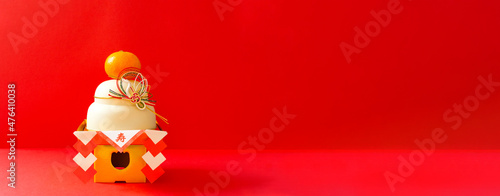 Japanese New Year. Kagami mochi on the red background. 日本のお正月。赤背景上の鏡餅