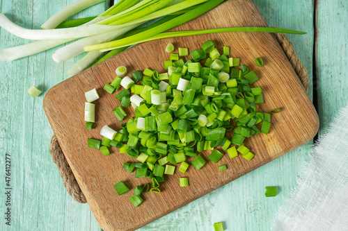 spring onion sliced for salad or seasoning on wooden surface