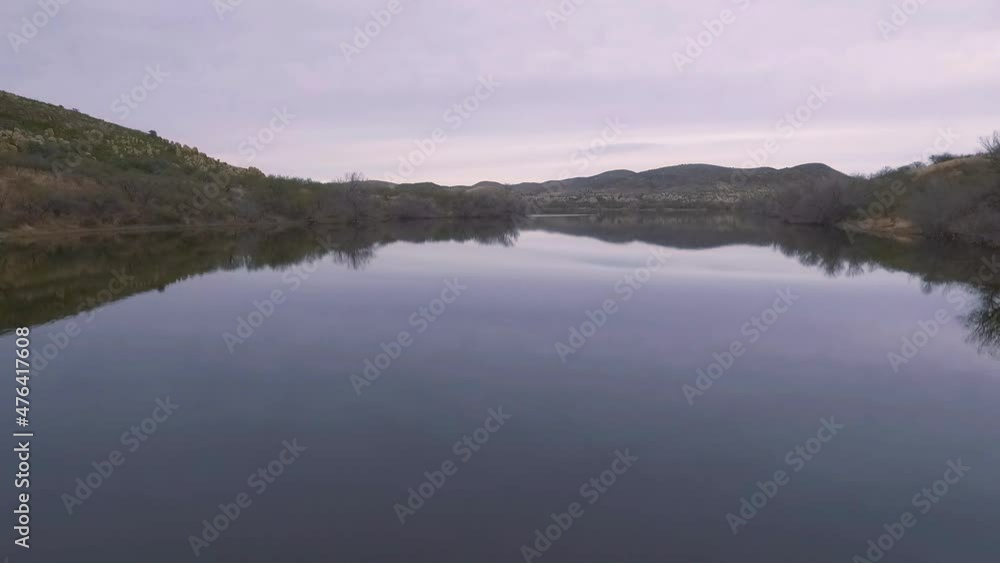 Aerial lift over a calm desert lake in Arizona Aerial lift over a calm desert lake in Arizona