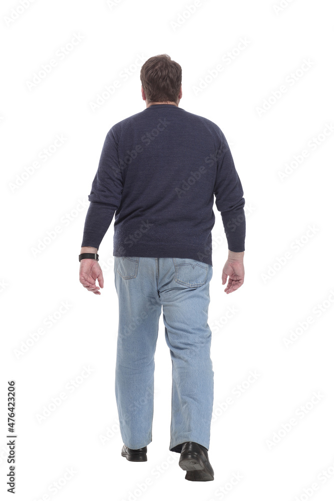 Mature man in jeans striding forward.isolated on a white background. Mature man in jeans striding forward.isolated on a white background.