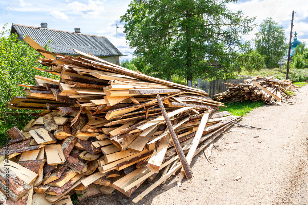 Stock pile of timber, chopped down trees at the village Stock pile of timber, chopped down trees at the village