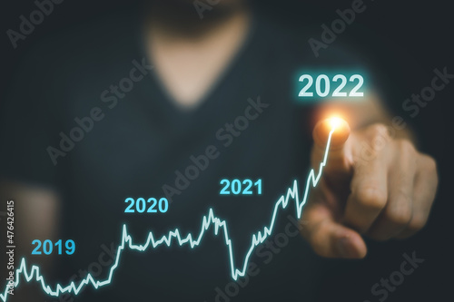 Fototapeta Naklejka Na Ścianę i Meble -  Businessman man hand touching virtual stock market graph chart for technical investment analysis concept