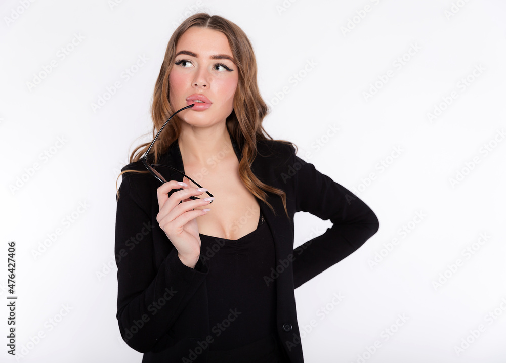 A business woman looking up and thinking with eyeglasses in hand isolated on white, copy space A business woman looking up and thinking with eyeglasses in hand isolated on white, copy space