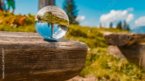 Crystal ball alpine summer landscape shot at the famous Purtschellerhaus near Berchtesgaden, Bavaria, Germany photo