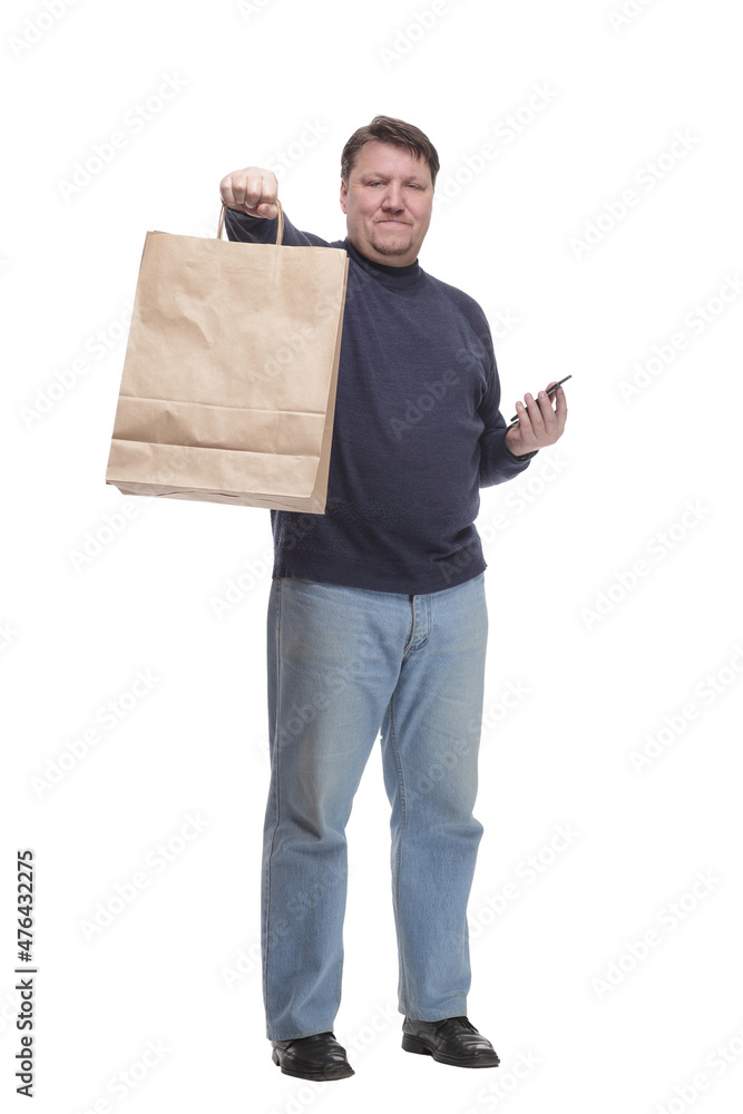 in full growth. casual man with a smartphone . in full growth. casual man with a smartphone .