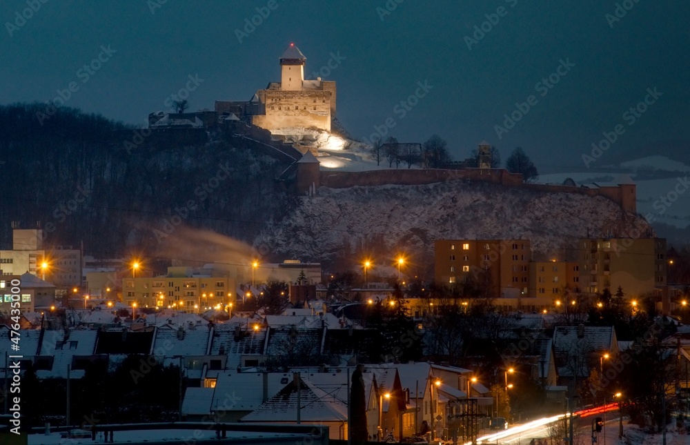 Snowy castle in the Slovak town of Trencin during the evening hours