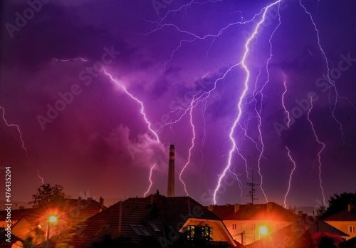 Chimney in hugs lightning during the summer night