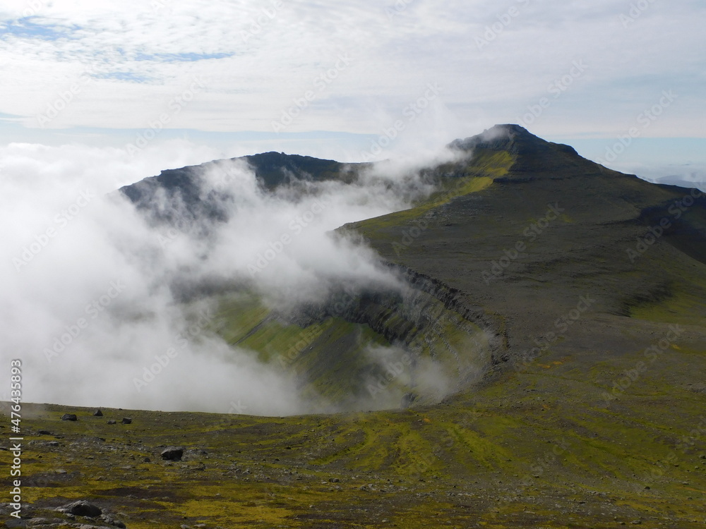 Hiking and sailing around the coast and green mountains of the Faroe Islands