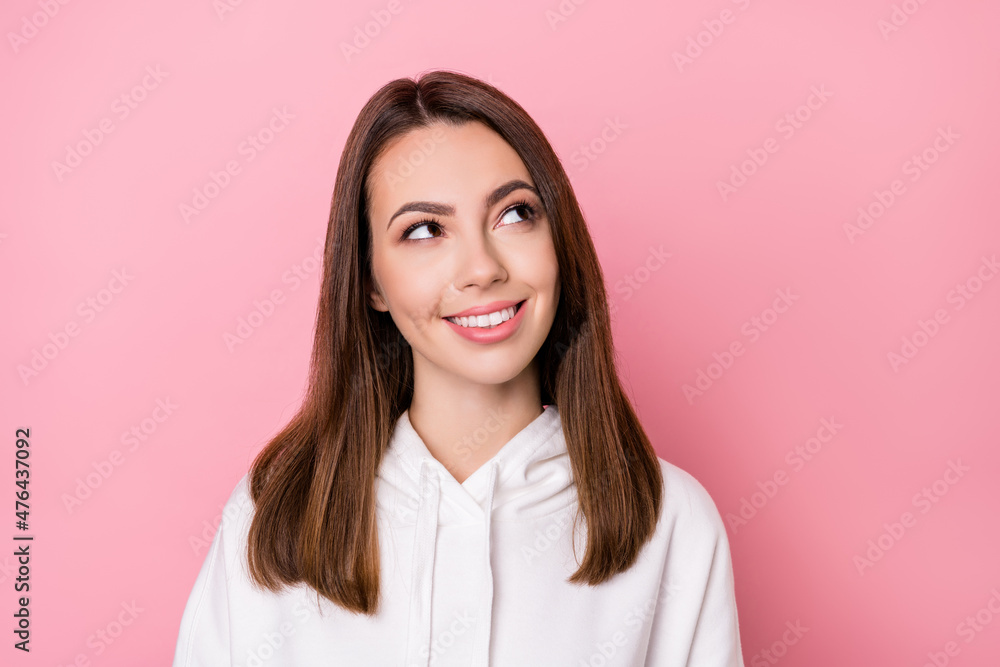 Photo of young cheerful girl happy positive smile curious interested look empty space isolated over pink color background Photo of young cheerful girl happy positive smile curious interested look empty space isolated over pink color background