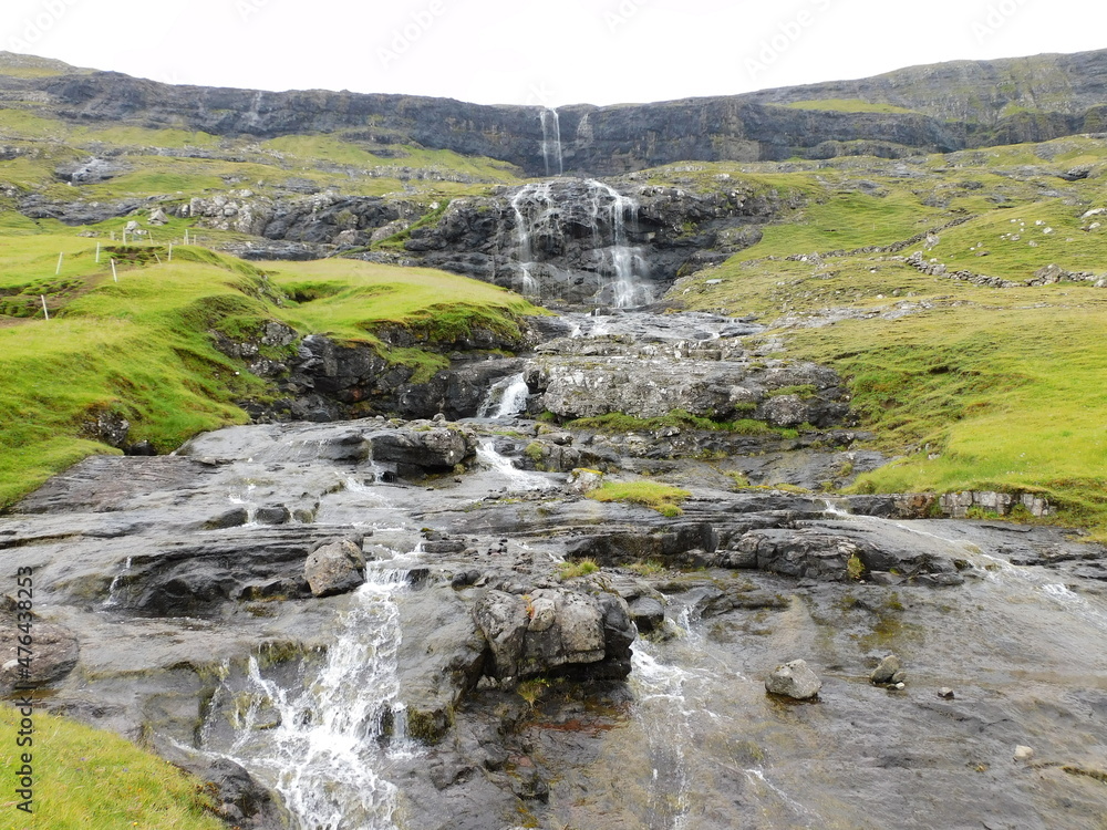 The beautiful Atlantic coastline and islets on the Faroe Islands The beautiful Atlantic coastline and islets on the Faroe Islands