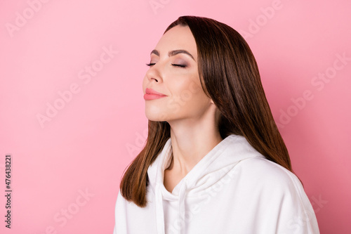 Profile side view portrait of attractive cheery peaceful dreamy girl harmony isolated over pink pastel color background