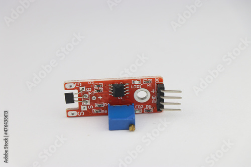 magnetic field sensor module for arduino projects with variable potentiometer on board isolated on white background photo