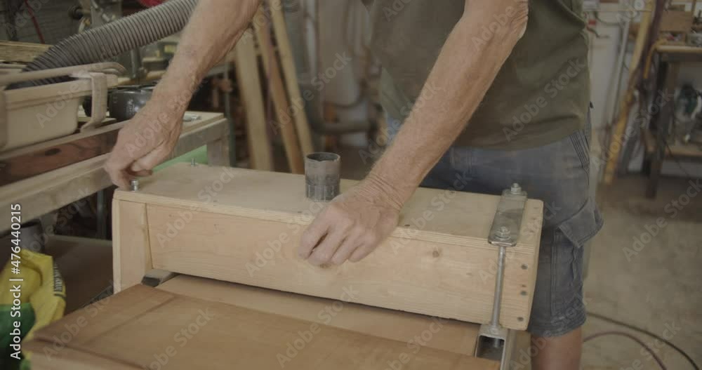 Old hands tightening a screw Old hands tightening a screw