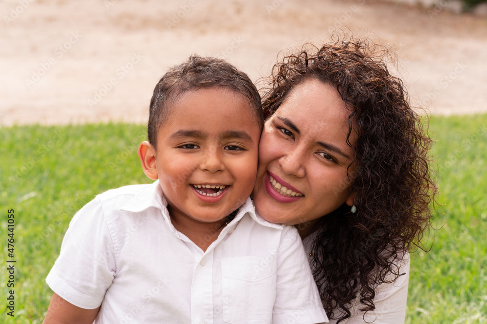 Portrait of Latin mother and child happy to be together in the park on a beautiful summer afternoon. Lifestyle. Portrait of Latin mother and child happy to be together in the park on a beautiful summer afternoon. Lifestyle.