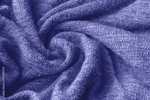 Trendy very peri color concept of the year 2022, violet blue, lavender knitted fabric texture. Rough blanket background
