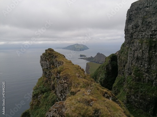 Dramatic cliffs, mountains and coastline on the lush Faroe Islands in the Atlantic Ocean