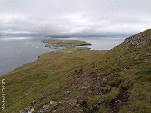 Dramatic cliffs, mountains and coastline on the lush Faroe Islands in the Atlantic Ocean