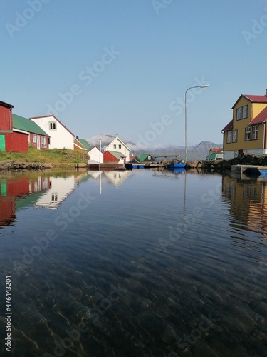 The cute and cozy old historical houses of the Faroe Islands with grass on the roof