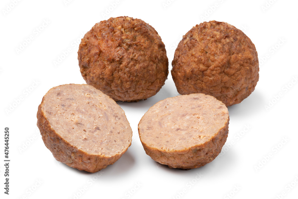 Whole and halved baked meatballs isolated on white background Whole and halved baked meatballs isolated on white background