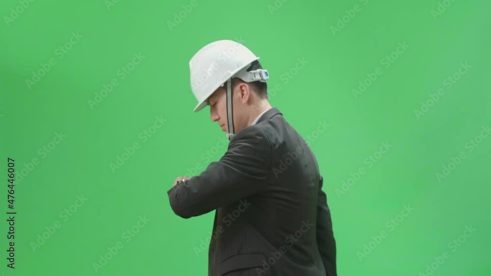 Side View Of Asian Chief Engineer In The Hard Hat Walks And Looking At Watch On Green Screen Chroma Key
Side View Of Asian Chief Engineer In The Hard Hat Walks And Looking At Watch On Green Screen Chroma Key