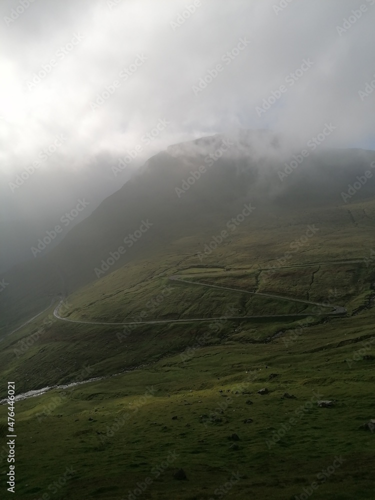 Stunning mountain views in the green and lush hills of the Faroe Islands in the Atlantic Sea Stunning mountain views in the green and lush hills of the Faroe Islands in the Atlantic Sea