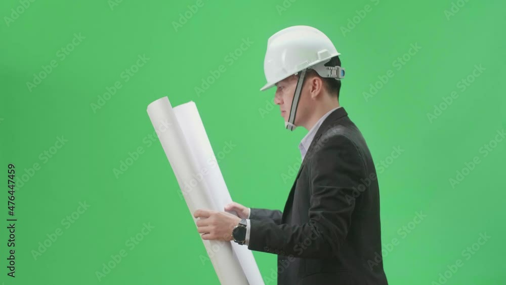 Side View Of Asian Chief Engineer In The Hard Hat Holding And Looking At Blueprint While Walks On Green Screen Chroma Key
Side View Of Asian Chief Engineer In The Hard Hat Holding And Looking At Blueprint While Walks On Green Screen Chroma Key