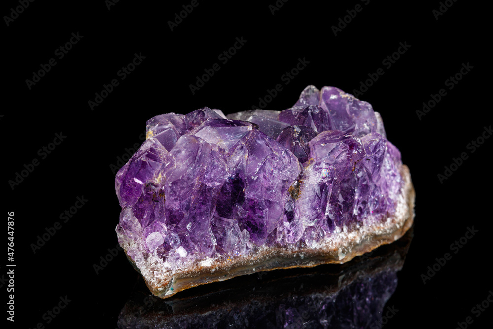 macro mineral stone Amethysts on a black background