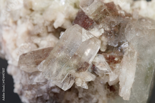 macro mineral stone Apophyllite stilbite on a gray background photo