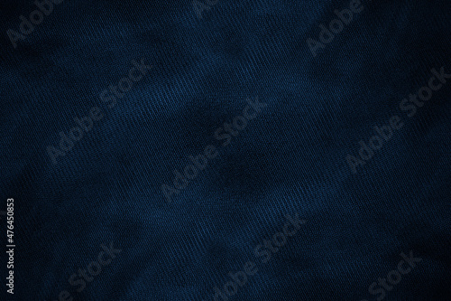 Dark blue abstract knitted fabric background with textile texture