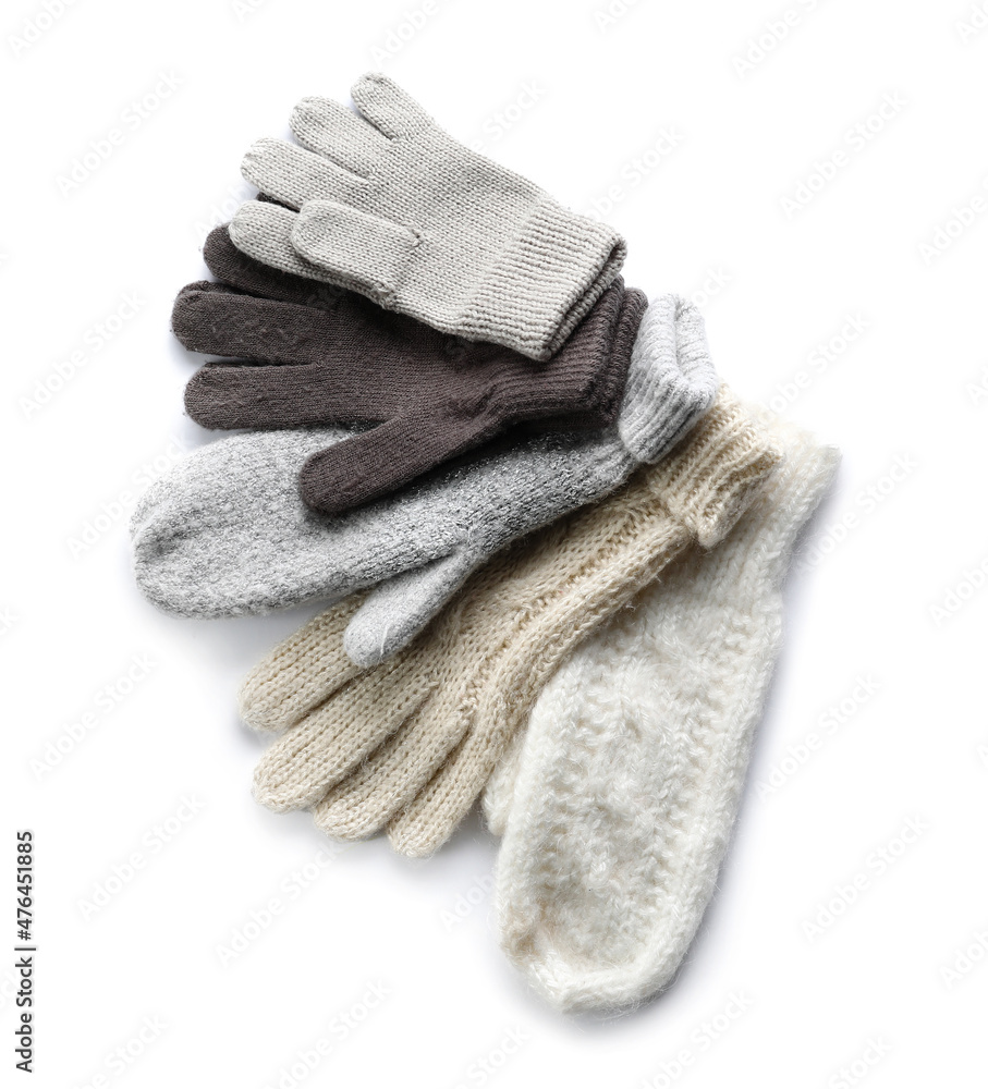 Different warm gloves and mittens on white background Different warm gloves and mittens on white background